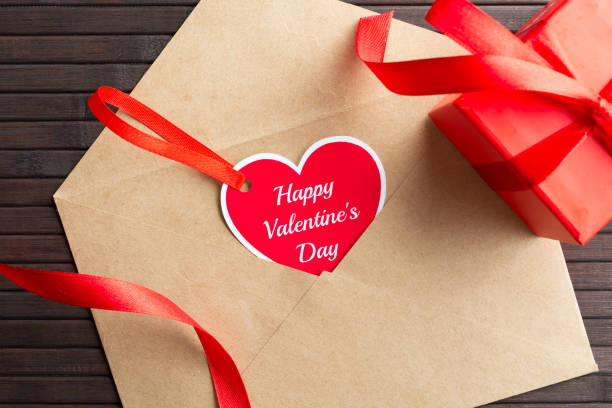 istock Letter with heart greeting card and present 903023562