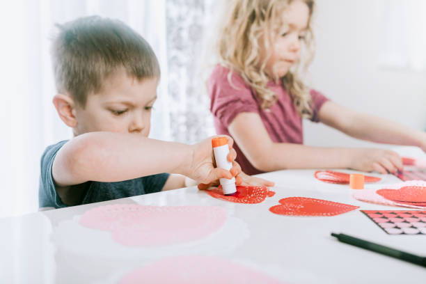 istock Family Making Valentine's Day Cards 903031184