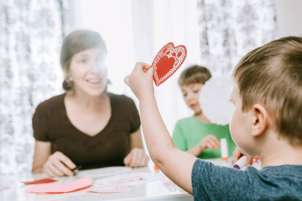 istock Family Making Valentine's Day Cards 903031384