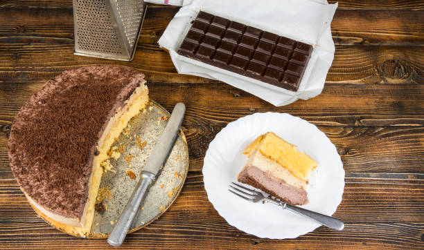 istock Homemade cheesecake with chocolate on wooden table 903031600