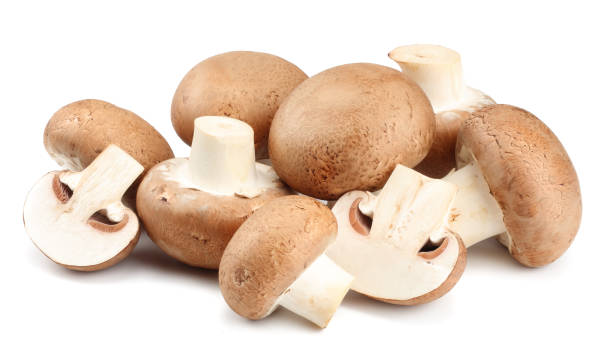 istock Fresh champignon mushrooms isolated on white background 903031842