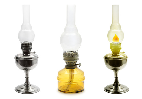 Set old vintage kerosene lamps isolated on white background