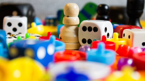 dice and small games for children mix of colorful little games for young and old board game stock pictures, royalty-free photos & images