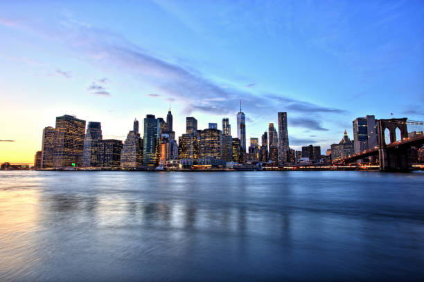 istock New York City Lower Manhattan with Brooklyn Bridge at Dusk 903035208