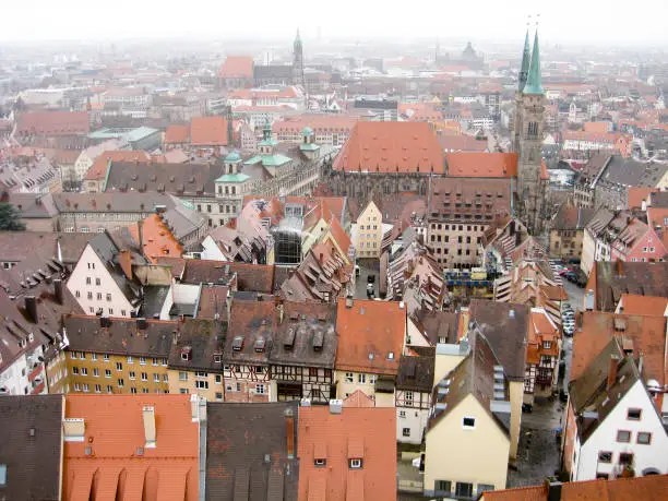 Panoramic view from the hill to the brown tile roofs of the houses in the old town of Nuremberg in wintertime, Germany