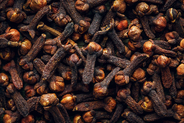 istock Raw organic brown dried cloves background 903037038