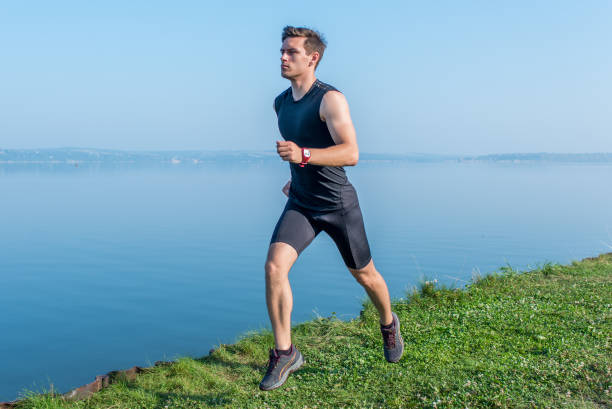 istock Young jogger running in morning Athlete runner working out cardio. 903039888