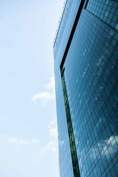 istock Detail blue glass building background with cloud sky 903040650