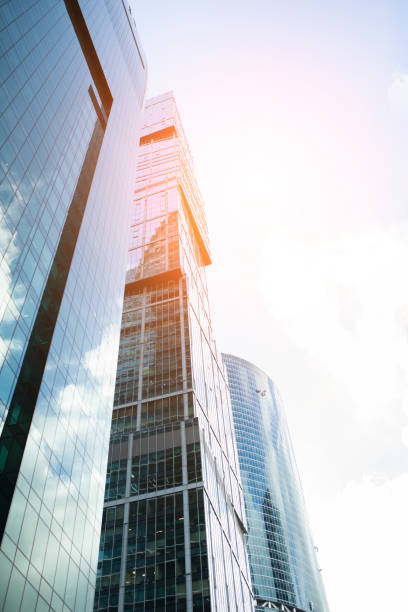istock Detail blue glass building background with cloud sky 903040754