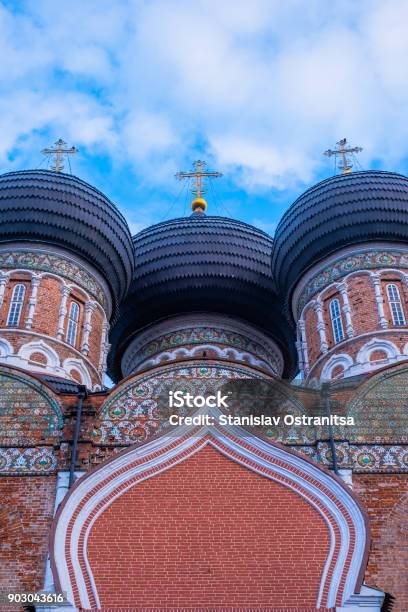 Domes With Crosses Of An Old Orthodox Church Against A Blue Sky With Clouds Stock Photo - Download Image Now