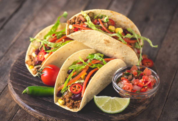 istock Mexican tacos with beef, vegetables and spices 903043672