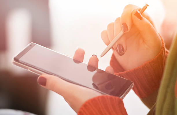 istock Woman hand selecting content on a smart phone 903044840