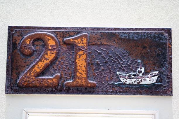 istock house number twenty one at old stone wall 903049668