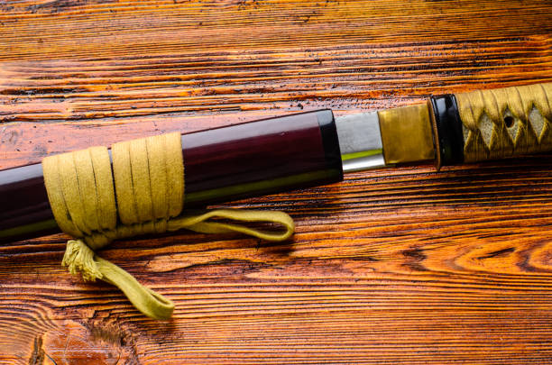 istock Japanese sword katana on wooden background 903050422
