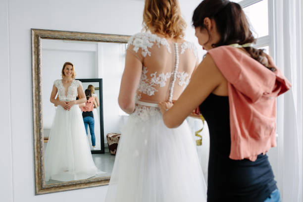 istock Bride trying on wedding dress in a shop 903053376