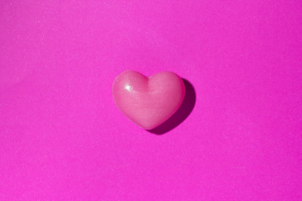 istock Red heart shape over purple color table. Valentine Day concept. 903054070