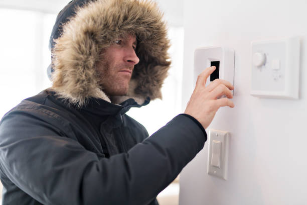 istock Man With Warm Clothing Feeling The Cold Inside House 903057752
