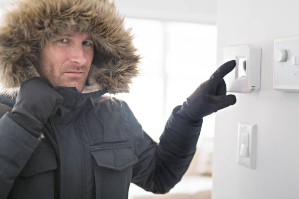 istock Man With Warm Clothing Feeling The Cold Inside House 903058102