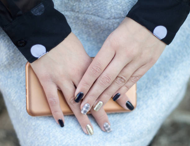 istock Hand of young woman using smartphone 903063052