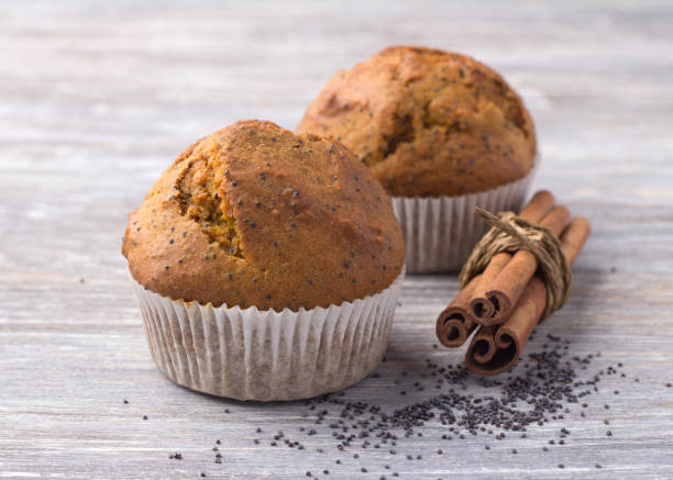 istock Pumpkin muffins with poppy seeds and cinnamon on a wooden table 903065892