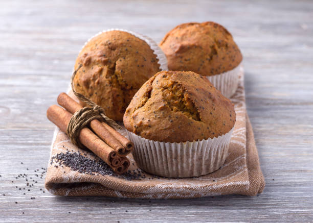istock Pumpkin muffins with poppy seeds and cinnamon on a wooden table 903065896
