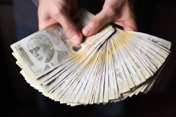 istock Hands holding pile of money 903068832