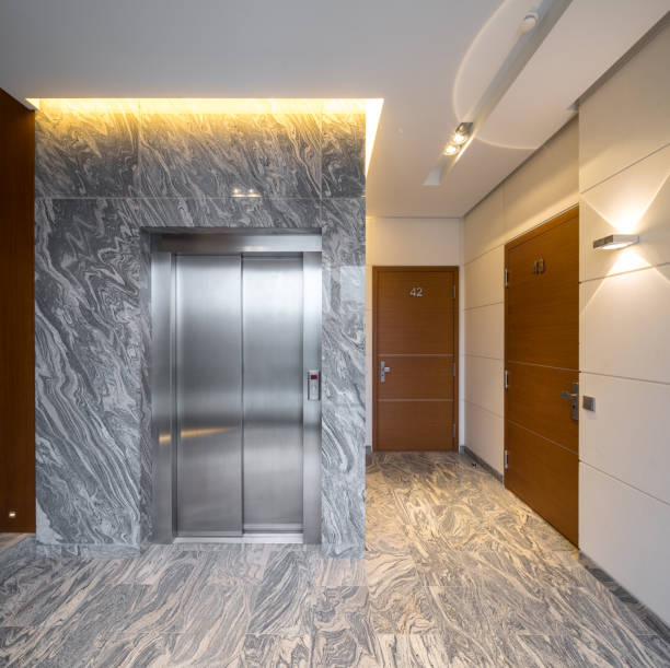 istock Hall staircase and elevator in a modern block of flats. 903070140