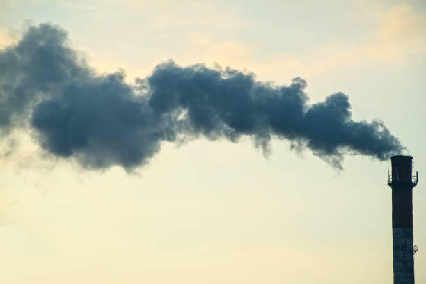 istock Pipe with smoke on a background of the sky close-up, with copy space. 903072804