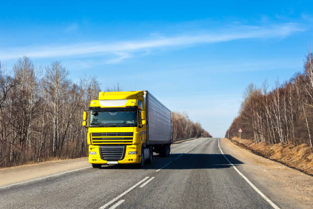 istock Yellow truck on a road 903072882