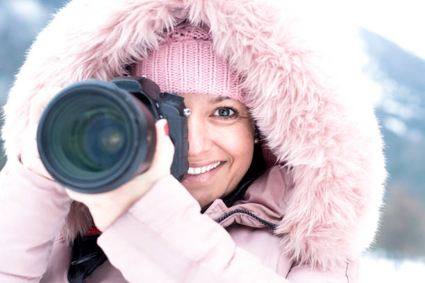 istock Female photographer in winter 903073408