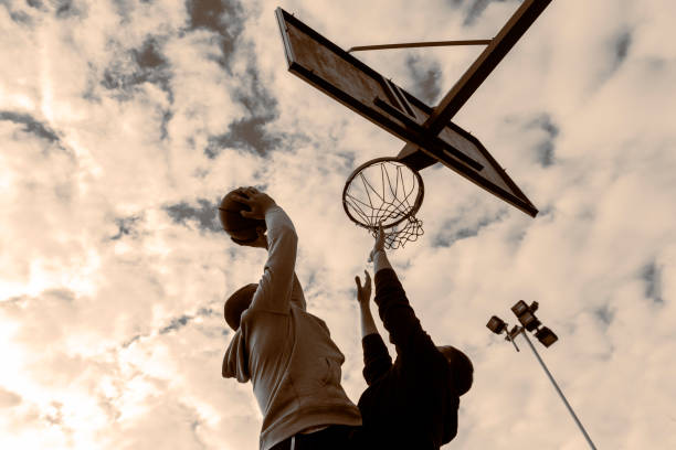 istock Two basketball players playing a friendly game 903073492
