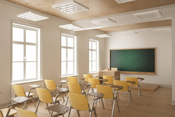 istock Student Desks and Chairs Arranged in a Row in the Classroom 903084892
