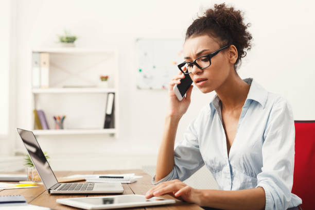 istock Business talk, serious woman talking on phone at office 903088074