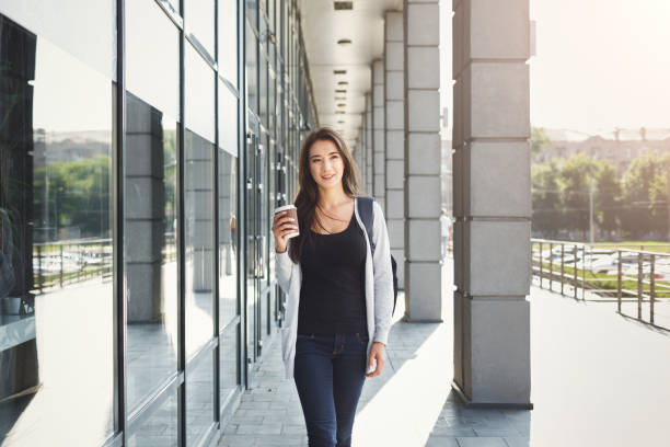 istock Beautiful student girl with backpack and coffee 903089820