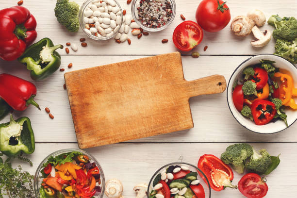 istock Various salad bowls on white wooden table, top view 903092958