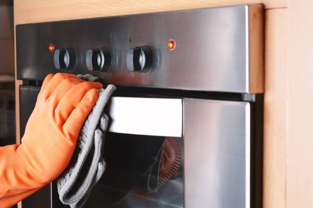 istock Housekeeping cleaning oven at home kitchen 903096402
