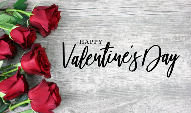 Happy Valentine's Day Calligraphy with Red Roses Happy Valentine's Day Calligraphy with Red Roses Over Rustic Wood Background valentines day holiday photos stock pictures, royalty-free photos & images