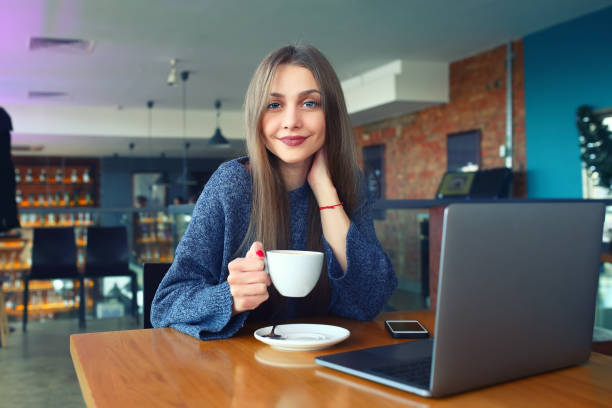 istock beautiful young girl resting in a cafe. Toned. Selective focus 903101276