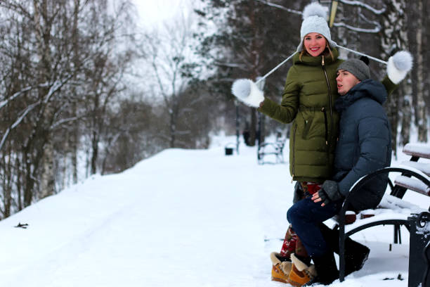 istock lovers in the park in winter 903105288