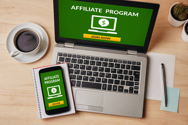 Affiliate program concept on laptop and smartphone screen stock photo