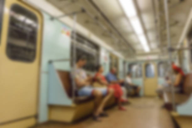 istock People inside metro train wagon at subway station, blurred and defocused background 903116928