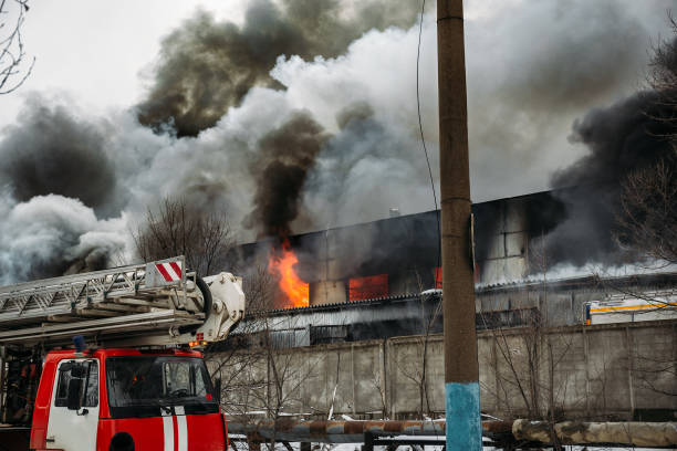 istock Burning industrial building with flames and black smoke 903119046