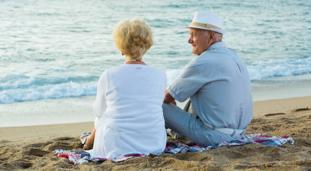 istock pensioners sitting back together at the sea 903120748