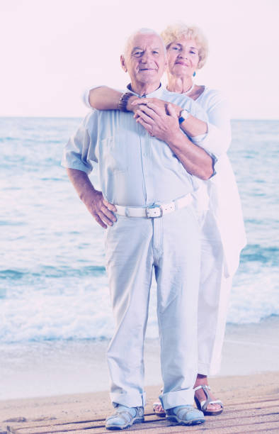 istock pensioners standing together on the sea coast 903120788