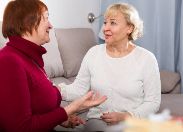istock Positive women on the sofa and talking 903120900