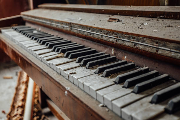 istock Old abandoned piano keyboard. Close up view 903126960