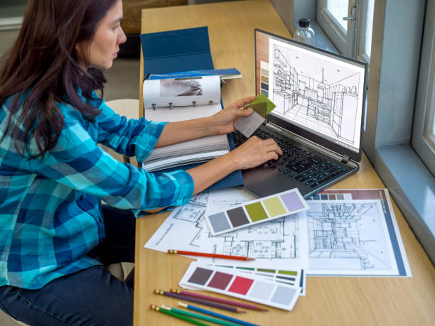 Architect (interior designer) working with drawing, material sample stock photo