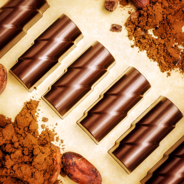 istock Chocolate pieces with cocoa beans and powder 903131746