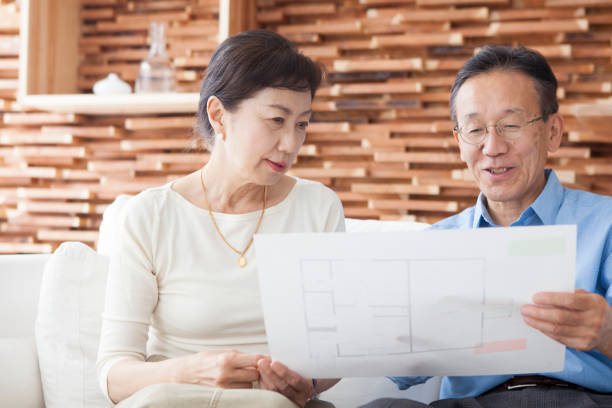 istock An elderly couple looking at the drawings. 903131976