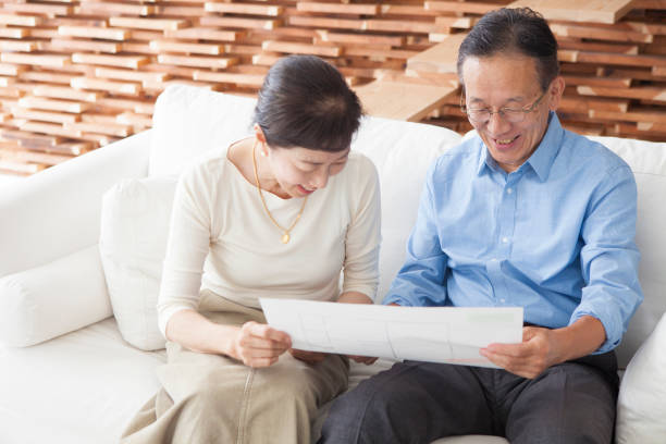 istock An elderly couple looking at the drawings. 903131978